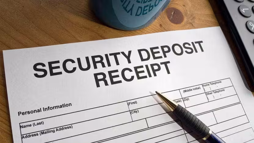 pen on paper that titled security deposit receipt