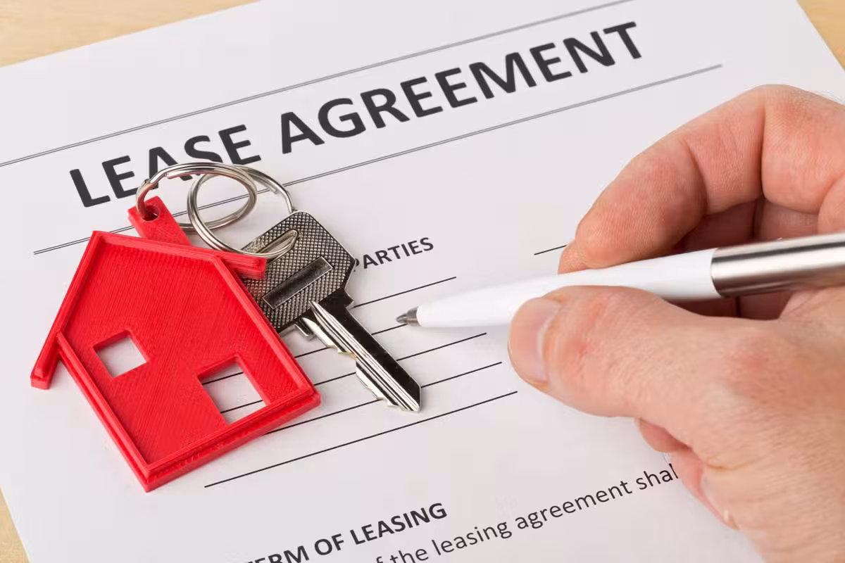 house key on lease agreement paper